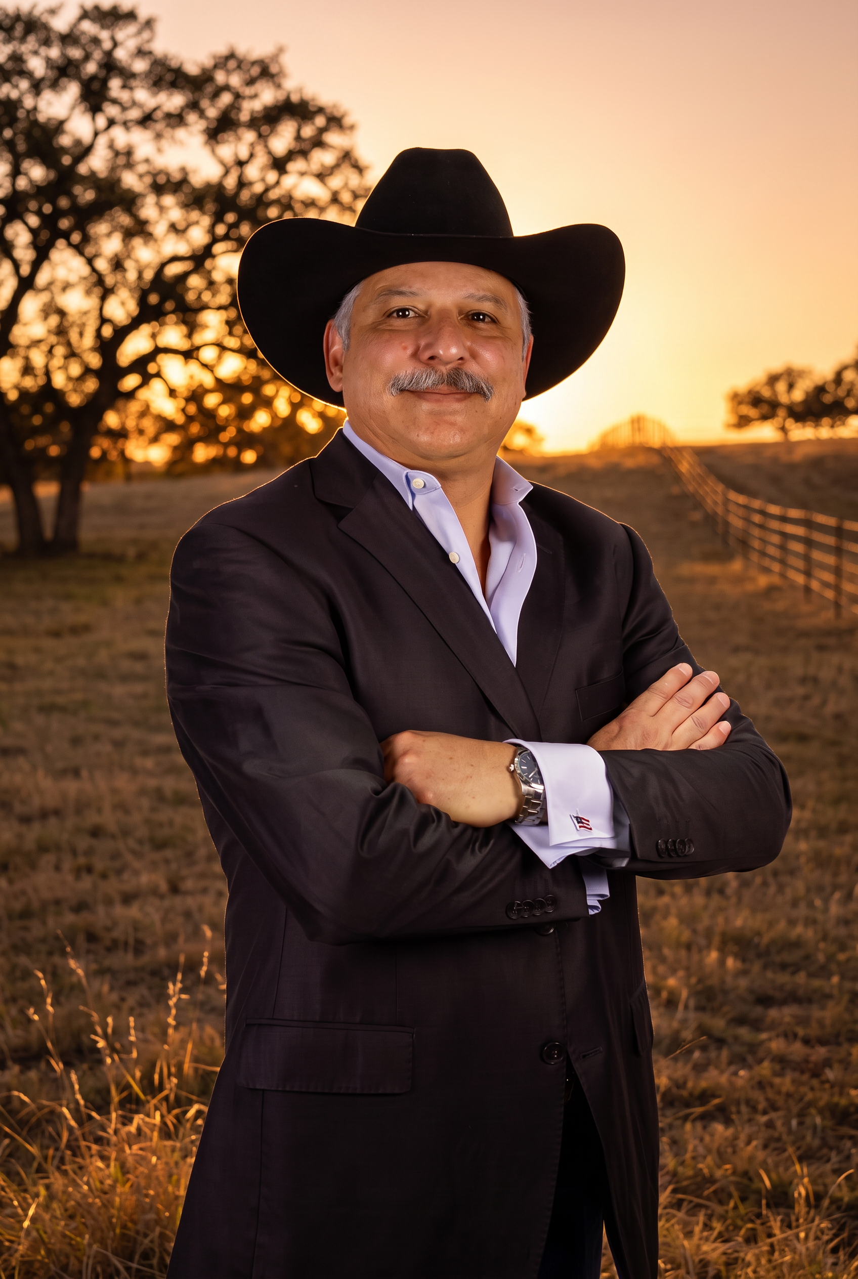 Fred Vela, Texas REALTOR® and General Contractor, in western professional attire at a Texas ranch